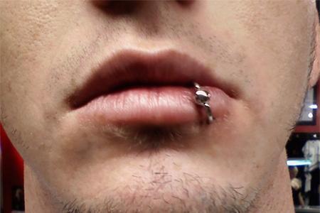 Close up of a boy's pierced lip lips-piercing-24