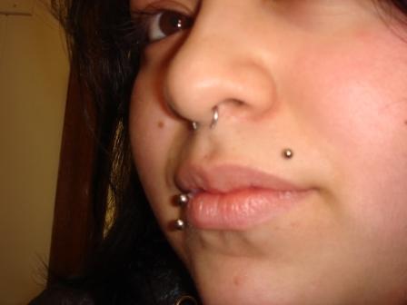 Girl shows her Monroe lip and septum piercings nosepiercing14