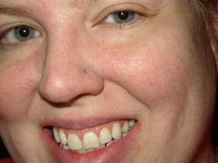 Delighted blonde lady with a stud pierced on her nose nose-piercing-22