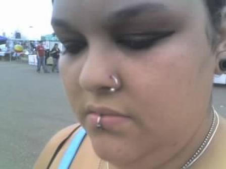 Lady walking on a street with her pierced nose and lips nose-piercing-5