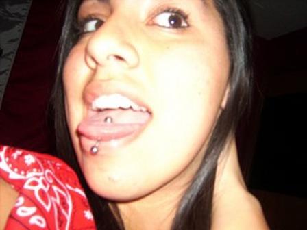 Graceful young girl shows her tongue piercing tongue-piercing-39