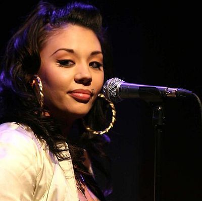 Mutya Buena With Mic – Monroe Piercing. English singer and songwriter with 