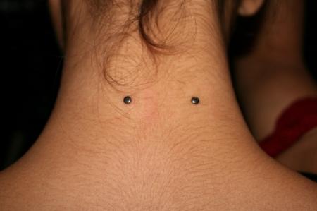 Close look of nape piercing on