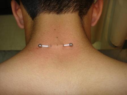 Guy Showing His Nape Piercing