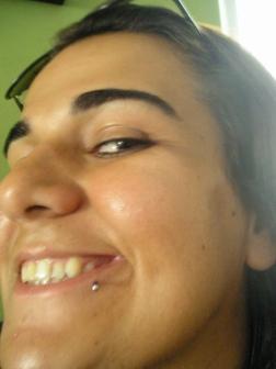 Smiling Girl Showing Her Labret Piercing