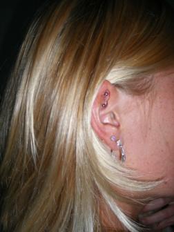 Beautiful And Curly Hairs - Ear Piercings