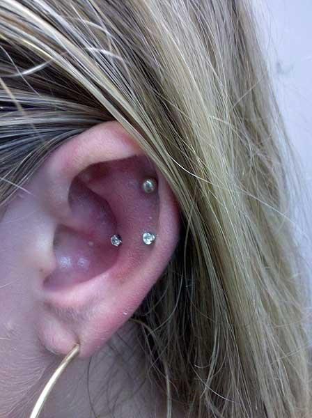 Snug , Outer Conch And Lope Piercing