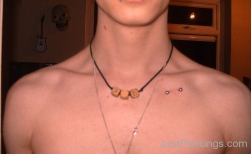 Guy With Anchor Clavicle Piercing