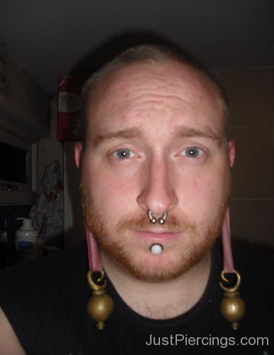 Septum And Scalpelled Labret Piercing