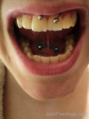 Smiley And Web Tongue Piercings