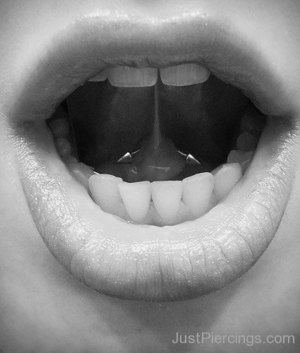 Tongue Piercing With Silver Cone