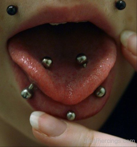 Angel Bites Tongue And Labret Piercing