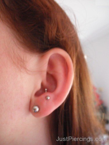 Anti Tragus And Lobe Piercing On Left Ear