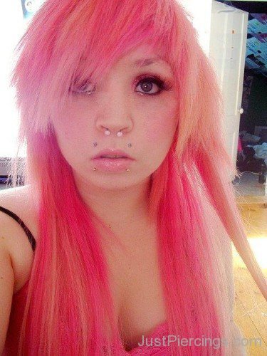 Girl With Angel Bites Piercing And Pink Hairs
