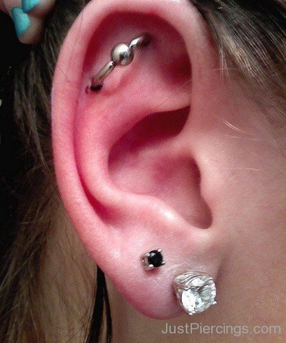 Outer Conch And dual Ear Lobe Piercing