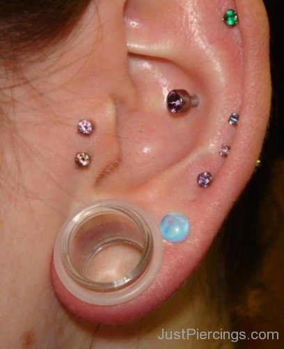 Lobe Stretching Conch and Double Tragus Piercing