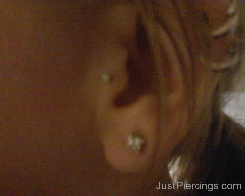 Tragus and Lobe Piercing on Left Year