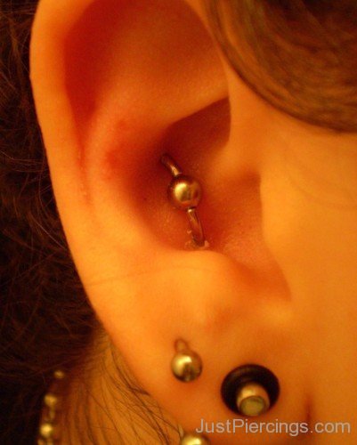 Lobe And Conch Piercing