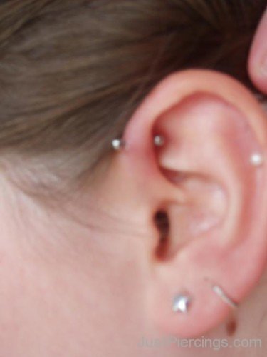 Lobe And Helix Piercing Photo