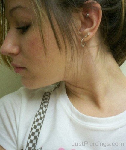 Lobe Rong And Rook Piercing