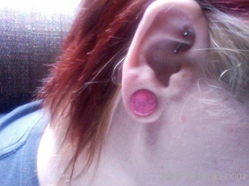 Pink Lobe And Rook Piercing