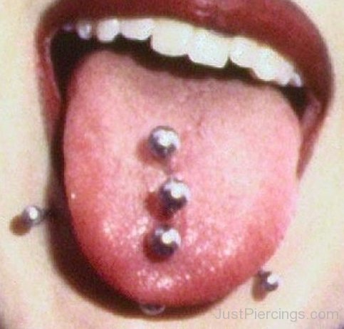 Snake Bite And Triple Tongue Piercing