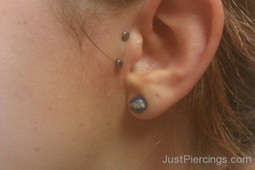 Tragus And Lobe Piercing Image