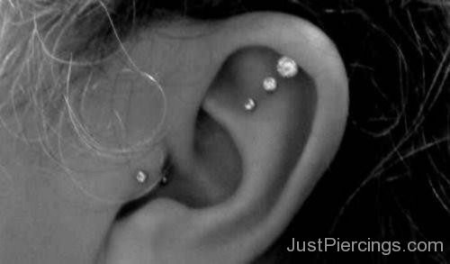 Tragus And Triple Helix Piercing