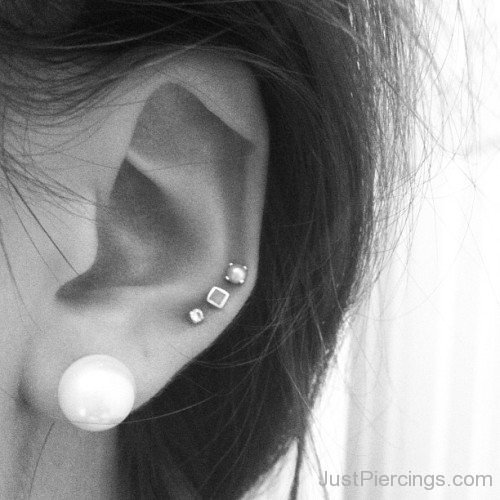 White Lobe And Helix Piercing