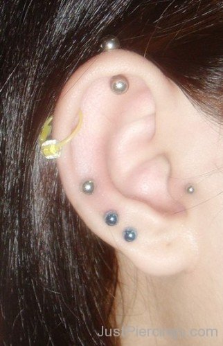 Yellow Helix Dual Lobe And Tragus Piercing