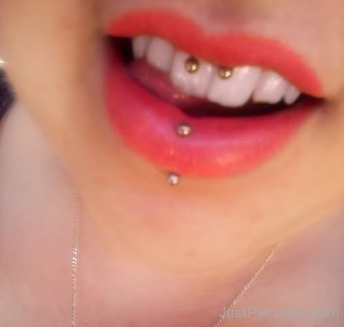 Awesome Vertical Labret And Smiley Piercing