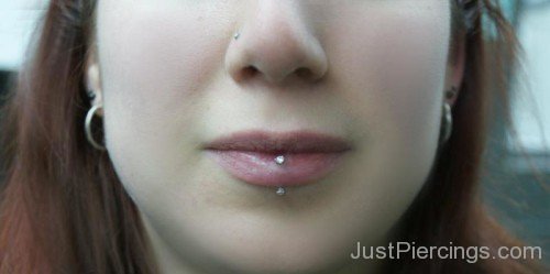 Nostril And Vertical Labret Piercings