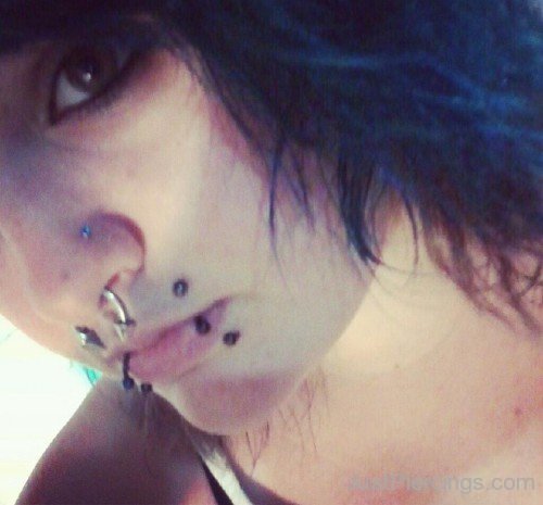 Septum And Canine Bites Piercing With Circular Barbells