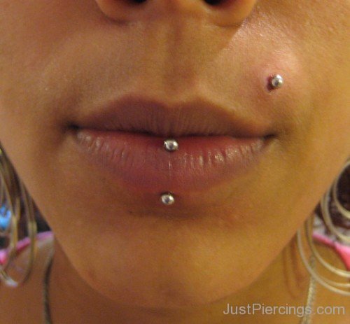Vertical Lip Piercing And Monroe Piercing