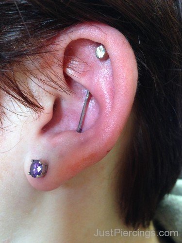 Amazing Left Ear Lobe And Vertical Industrial Piercing