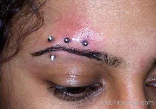 Eyebrow Horizontal Piercing With Barbell And Cone Stud
