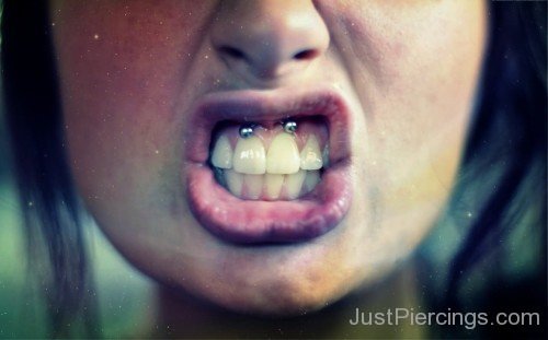 Girl Have Upper Lip Frenulum Piercing With Curved Barbell