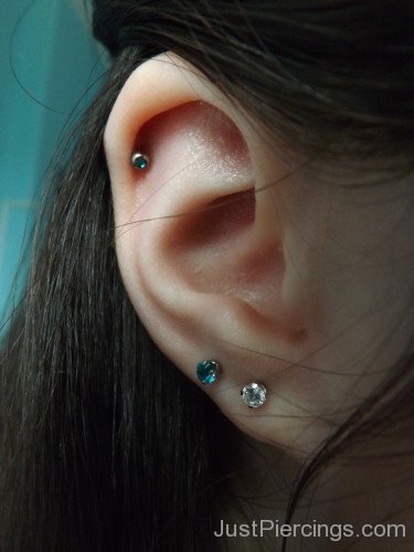 Lobe Piercing With Colorful Studs