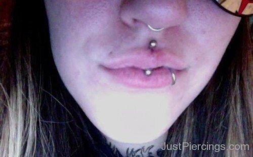 Lower Lip And Jestrum Piercing With Silver Barbell