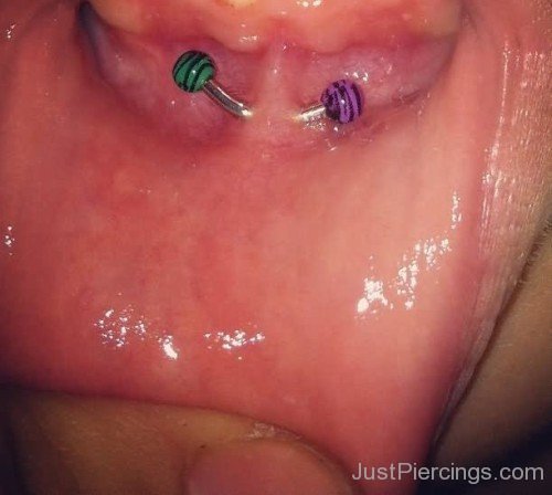 Lower Lip Frowney Piercing with Color Barbell