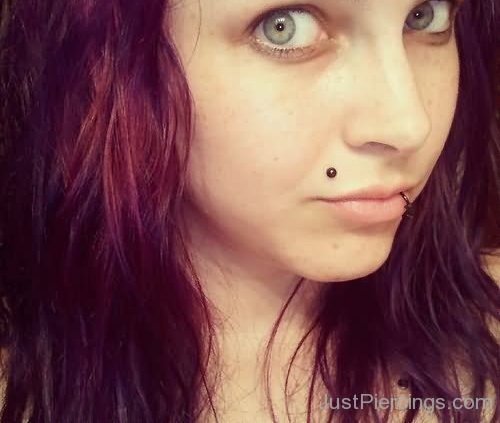 Madonna Piercing With Black Stud And Lowerlip Piercing