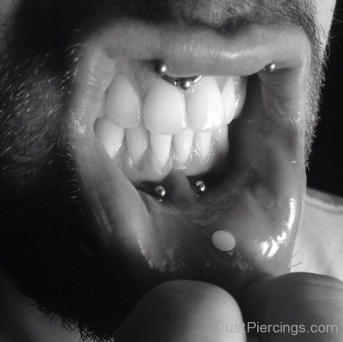 Man Showing His Upper Lip Frenulum Piercing