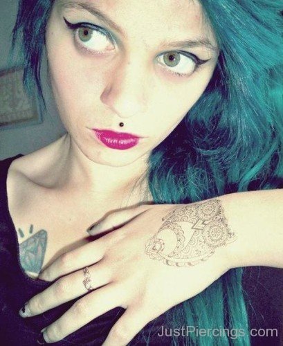 Medusa Piercing And Diamond Tattoo