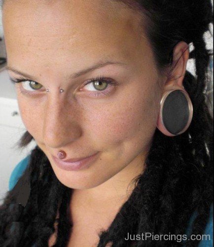 Medusa Piercing And Ear Stretching