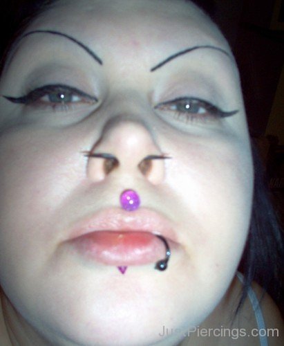 Medusa Piercing With Purple Barbell