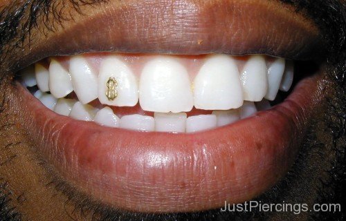 Men With Tooth Jewel Piercing With Dollar Sign