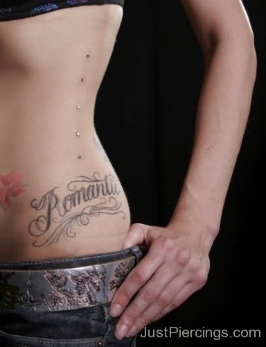 Romantic Tattoo And Dermal Anchors Healed Piercing On Rib