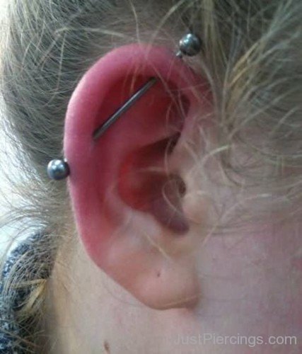 Scaffold Piercing On Girl Right Ear
