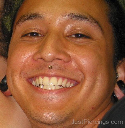 Smiling Picture Of Man Having Medusa Piercing