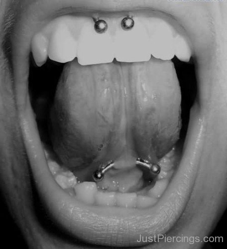 Web Tongue Piercing With Curved Barbell And Smiley Piercing